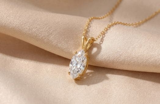 Diamond pendant necklace on beige satin